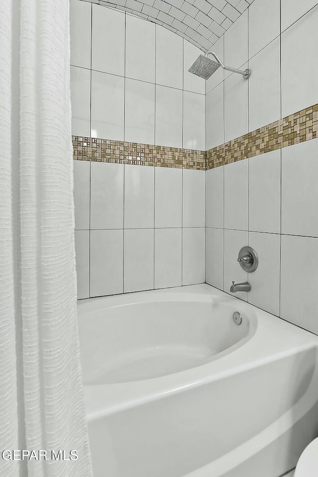 bathroom featuring shower / bath combination with curtain