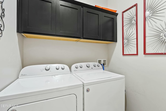 washroom with cabinets and independent washer and dryer