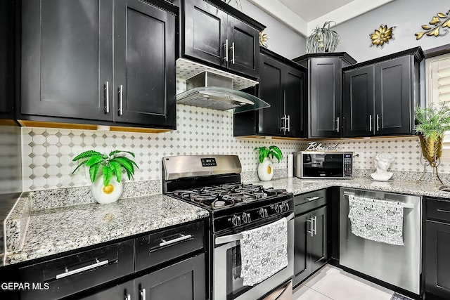 kitchen with tasteful backsplash, ventilation hood, and appliances with stainless steel finishes