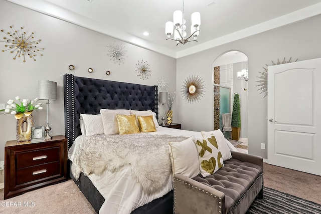 carpeted bedroom featuring crown molding and a notable chandelier