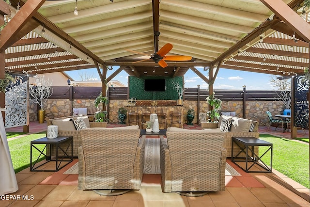 view of patio / terrace with ceiling fan and outdoor lounge area