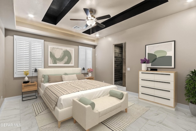 bedroom with ceiling fan and a tray ceiling