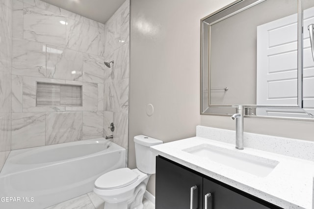 full bathroom featuring toilet, vanity, and tiled shower / bath