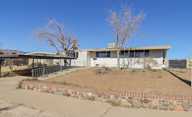 view of front of home with a carport