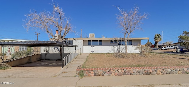 view of front of house featuring a carport