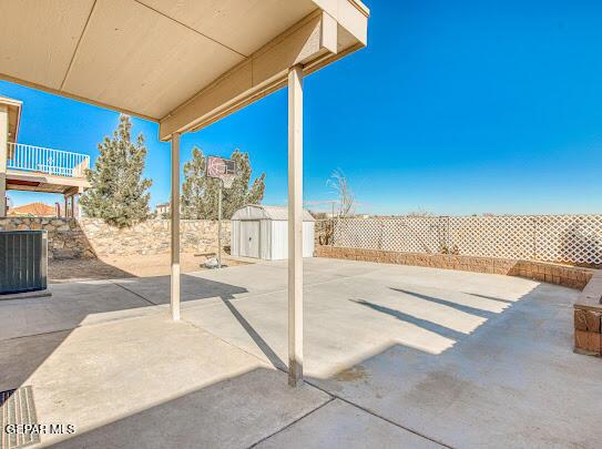 view of patio / terrace featuring a storage shed