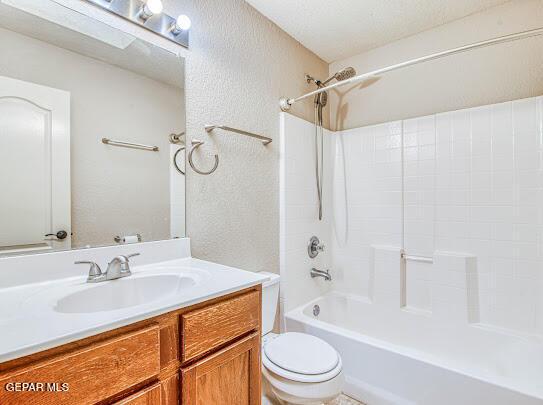 full bathroom featuring toilet, vanity, and shower / bathing tub combination