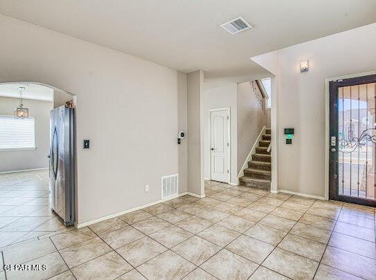 tiled foyer with a wealth of natural light