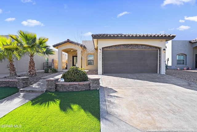 mediterranean / spanish home with a garage