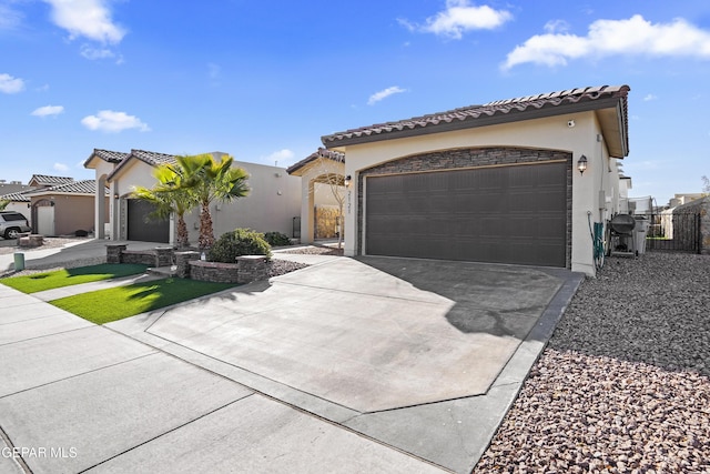 mediterranean / spanish-style home featuring a garage