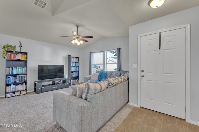 carpeted living room with ceiling fan and lofted ceiling