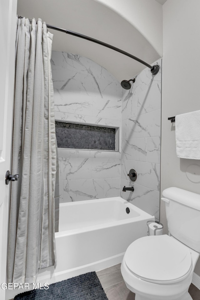 bathroom featuring toilet, shower / tub combo, and hardwood / wood-style floors