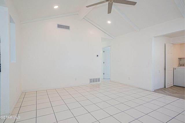 tiled empty room with ceiling fan, washer / dryer, and lofted ceiling with beams