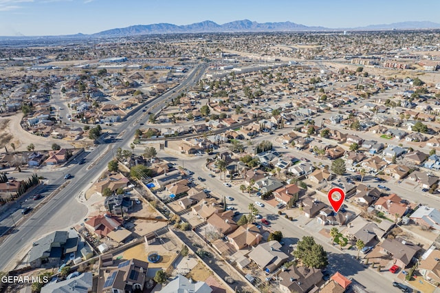 birds eye view of property with a mountain view