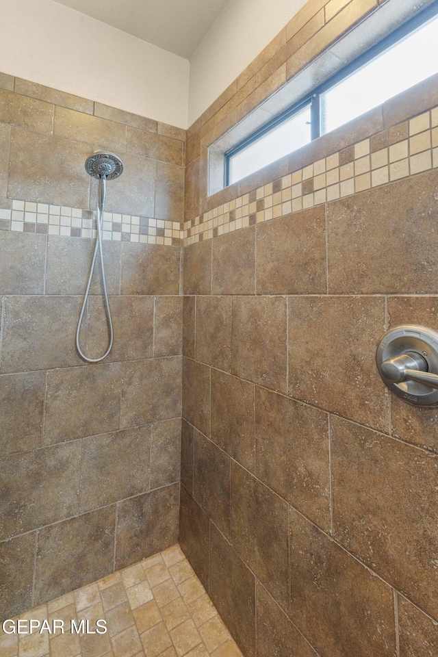 bathroom featuring tiled shower