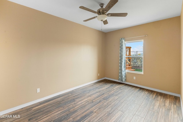 unfurnished room with ceiling fan and hardwood / wood-style flooring