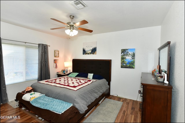 bedroom featuring dark hardwood / wood-style floors and ceiling fan