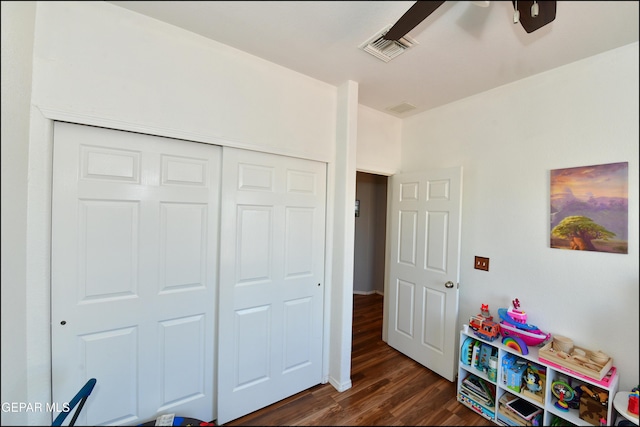 recreation room with dark wood-type flooring