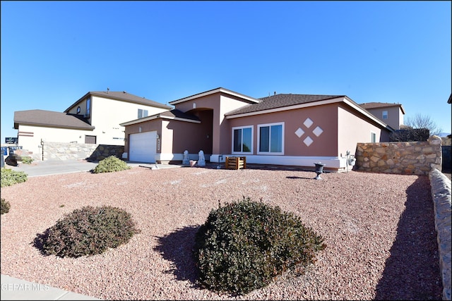 view of front of property with a garage