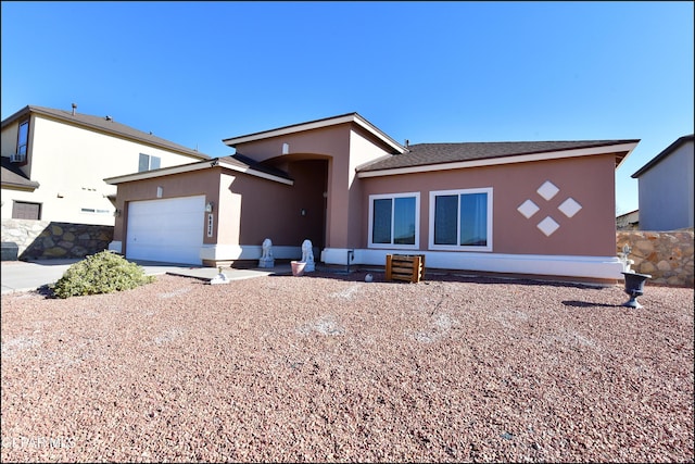 view of front of property featuring a garage