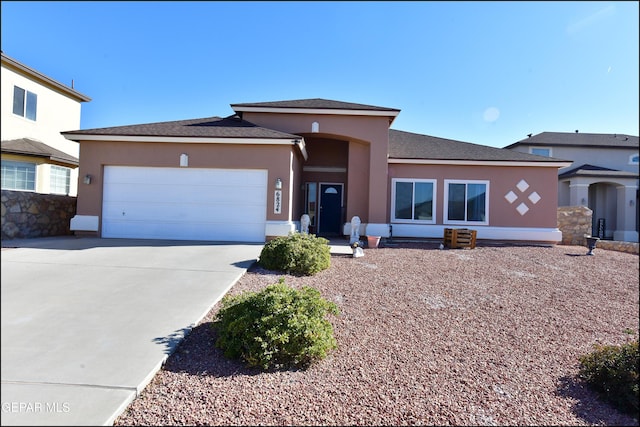 prairie-style house featuring a garage