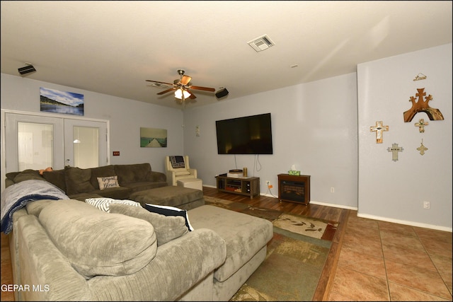 living room with french doors and ceiling fan