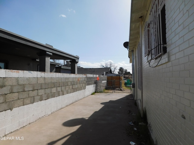 view of side of property featuring a patio area