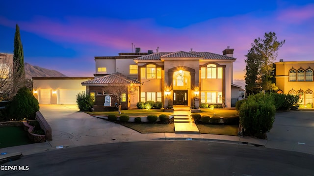 mediterranean / spanish-style house featuring a garage