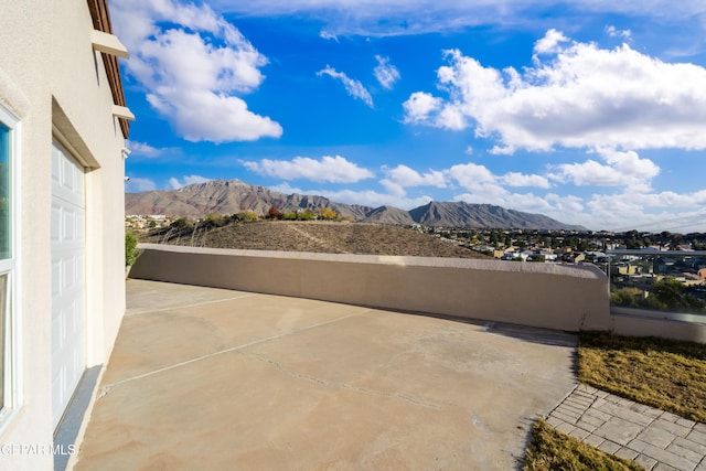 view of patio / terrace featuring a mountain view