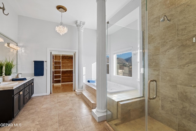 bathroom with decorative columns, tile patterned floors, vanity, and plus walk in shower