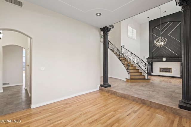 unfurnished living room with hardwood / wood-style floors