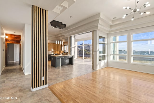 interior space with light tile patterned floors and a chandelier