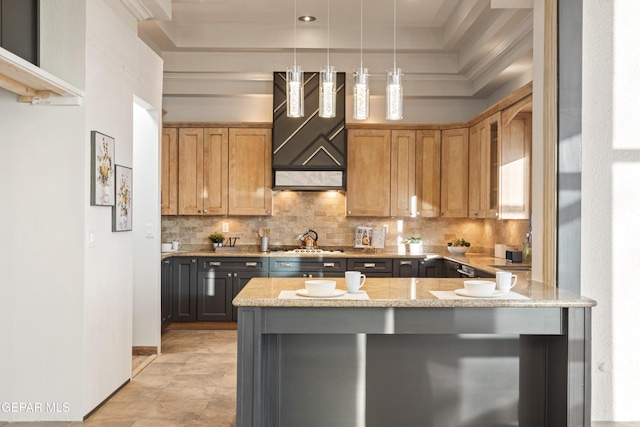 kitchen featuring decorative light fixtures, wall chimney range hood, decorative backsplash, kitchen peninsula, and light stone countertops