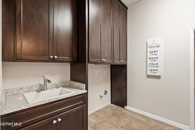 washroom featuring cabinets and sink