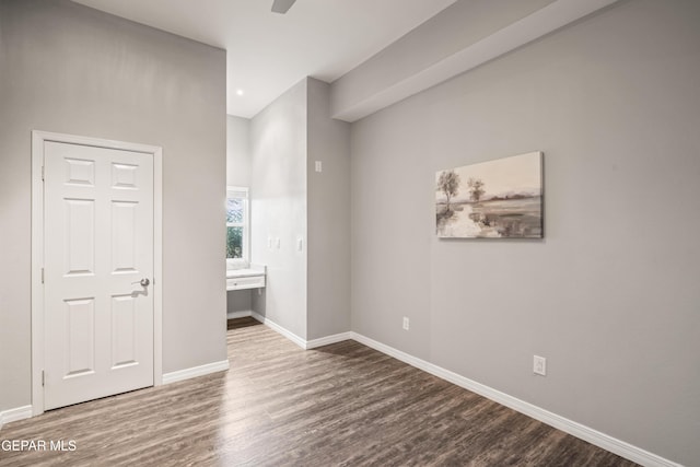 unfurnished bedroom featuring ceiling fan and hardwood / wood-style floors