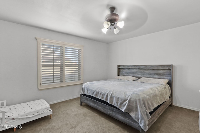 bedroom featuring light carpet and ceiling fan