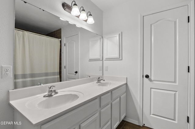 bathroom with vanity and tile patterned flooring