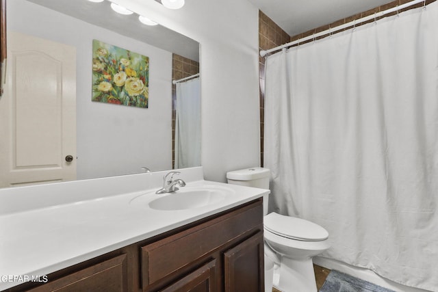 bathroom with toilet and vanity