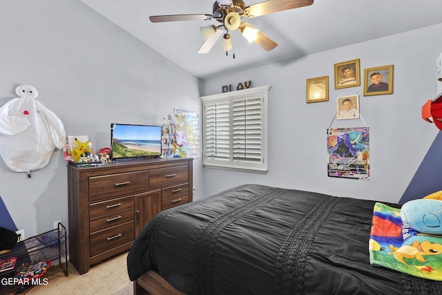 carpeted bedroom with ceiling fan and lofted ceiling