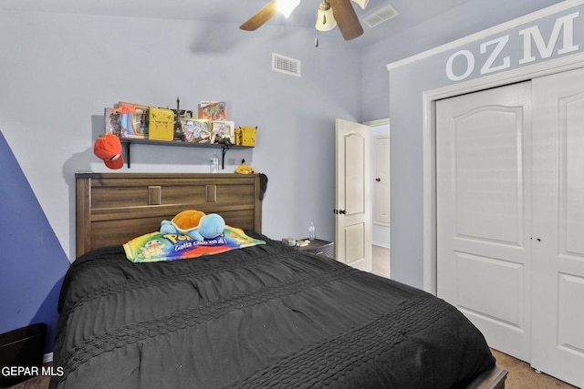 carpeted bedroom with ceiling fan and a closet