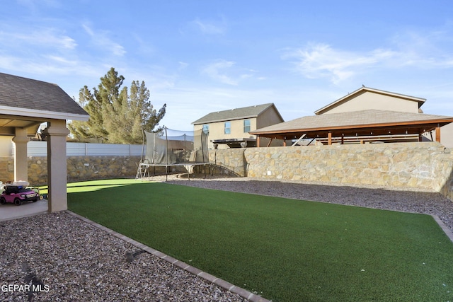 view of yard featuring a trampoline