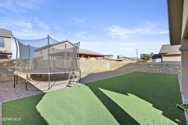 view of yard with a trampoline