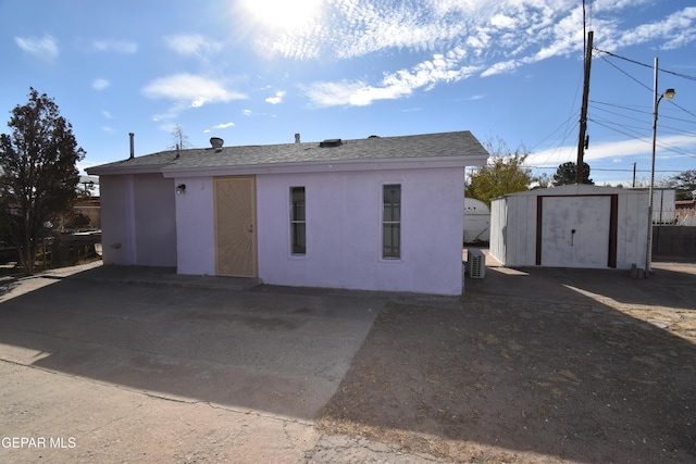 exterior space with a storage shed