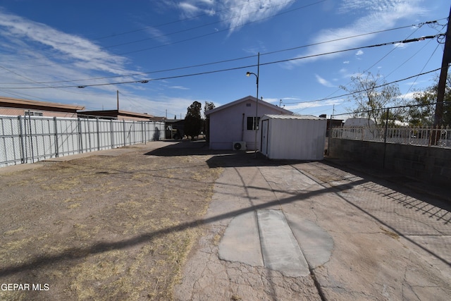 back of property with a shed