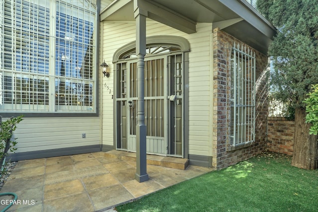 entrance to property with a patio area