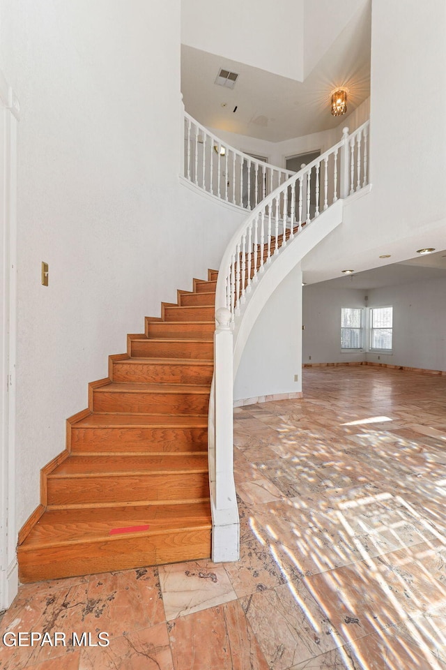 stairway with a high ceiling