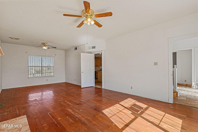 spare room featuring wood-type flooring