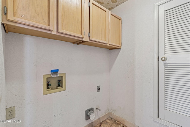 washroom featuring washer hookup, cabinets, hookup for a gas dryer, and electric dryer hookup