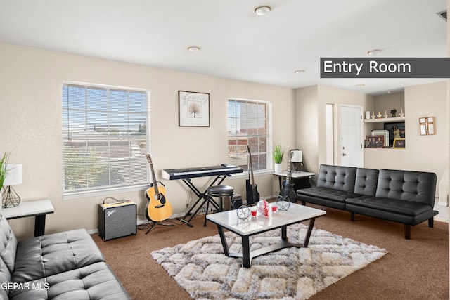 living room with a wealth of natural light and carpet floors