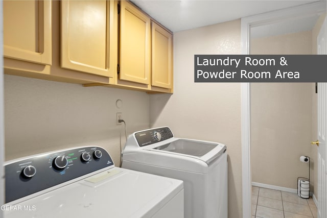 washroom featuring cabinets, separate washer and dryer, and light tile patterned flooring